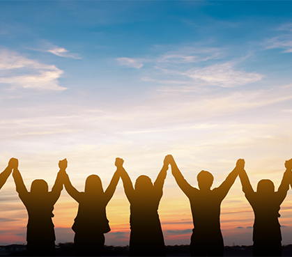 Silhouettes of People Holding Hands