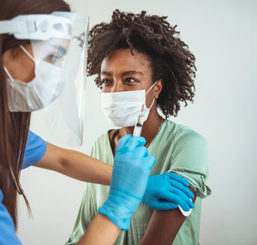 Person getting vaccinated by a provider