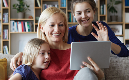 Mother and kids looking at digital records on tablet