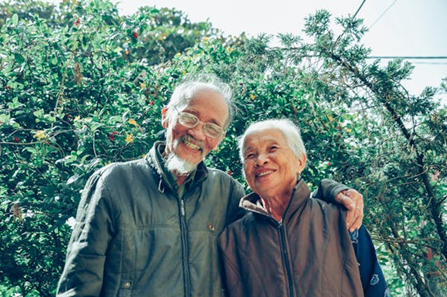 Older Adult Couple Together Smiling